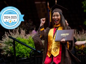 A woman in cap and gown holds her diploma and smiles widely. The diploma case reads "Adelphi University." The insignia superimposed to the left reads "Best Colleges 10 Years: Colleges of Distinction 2024–2025