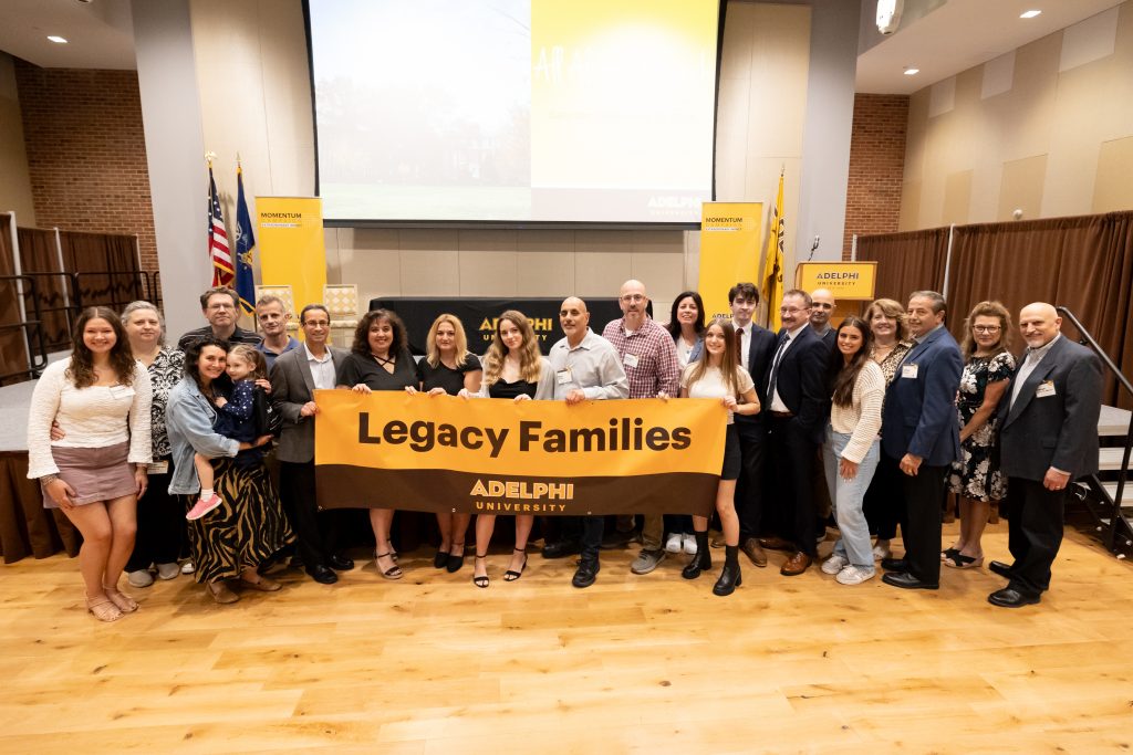 Group of People holding a Legacy Families banner