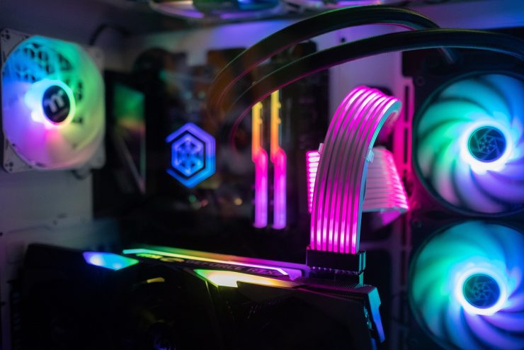 Close up of a gaming computer with rainbow led lights.