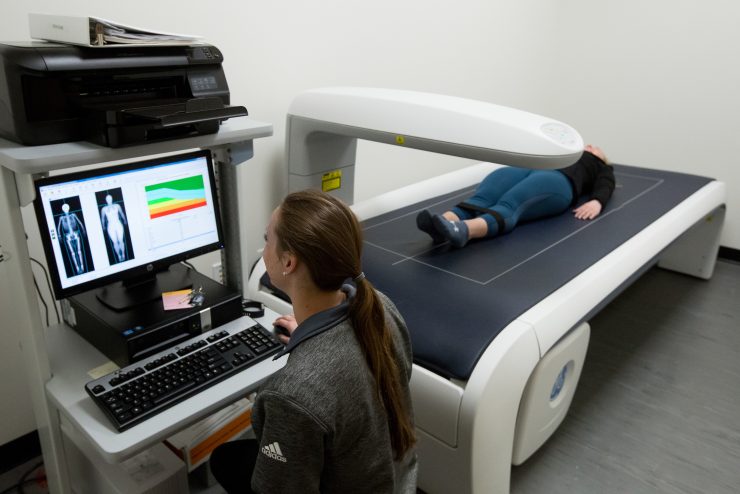 Exercise Science Lab - A student scans an athlete and reads out the data on the screen