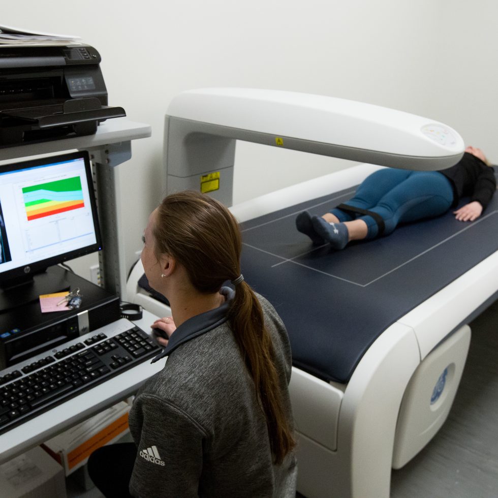 Exercise Science Lab - A student scans an athlete and reads out the data on the screen