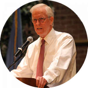 Robert Willumstad speaking at a podium.