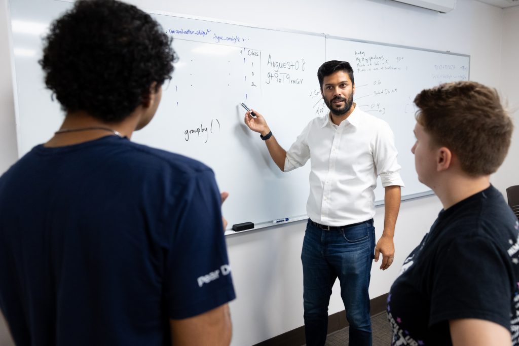 High school students work closely with their professors at the Adelphi Summer Institute in Mathematical Epidemiology (ASIME).