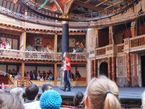 An actor on stage at the Globe Theatre in London.