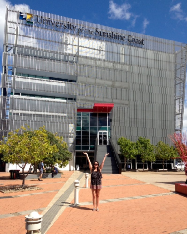An Adelphi student in front of the University of the Sunshine Coast.