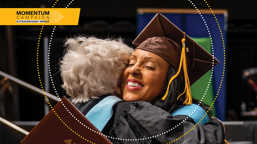 A graduate hugging their professor at Adelphi University Commencement. Momentum Campaign for Adelphi University