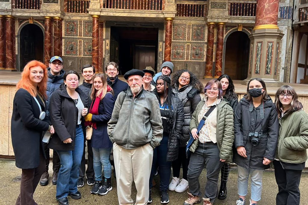 A group of students in front of a theatre in London.