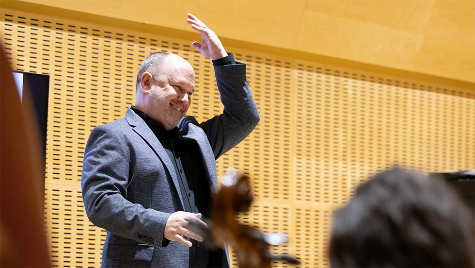 Professor Jordan leads musicians from the podium.