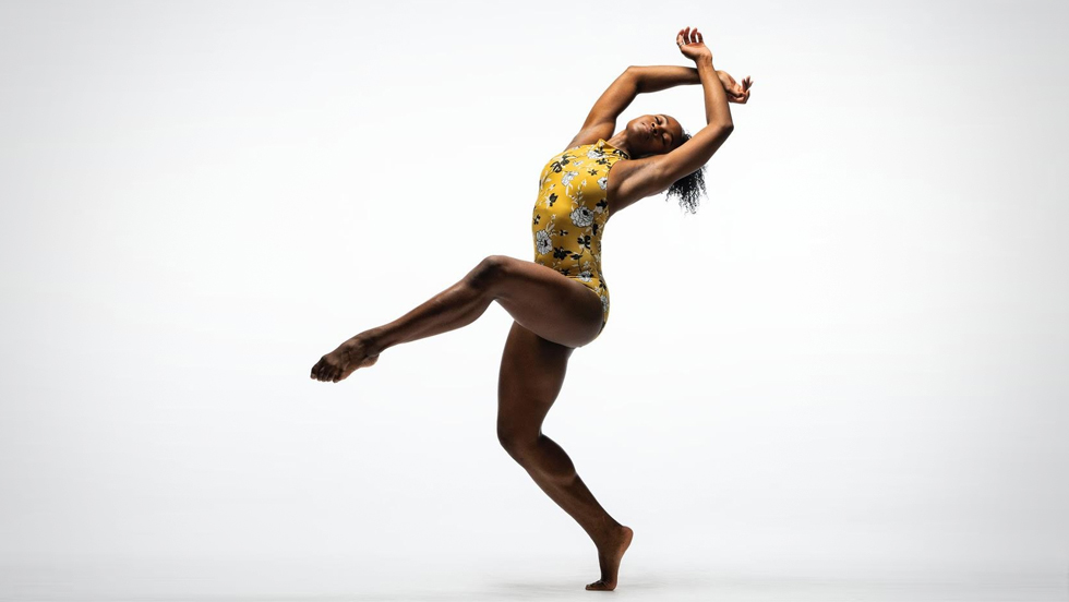 A young Black female dancer in a dance pose