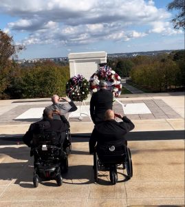 Four men saluting at the Tomb of the Unknown Soldier  